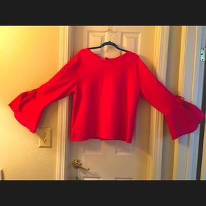 Pink sweatshirt. Detailed arms slotted belled cuff. Ribbon closure